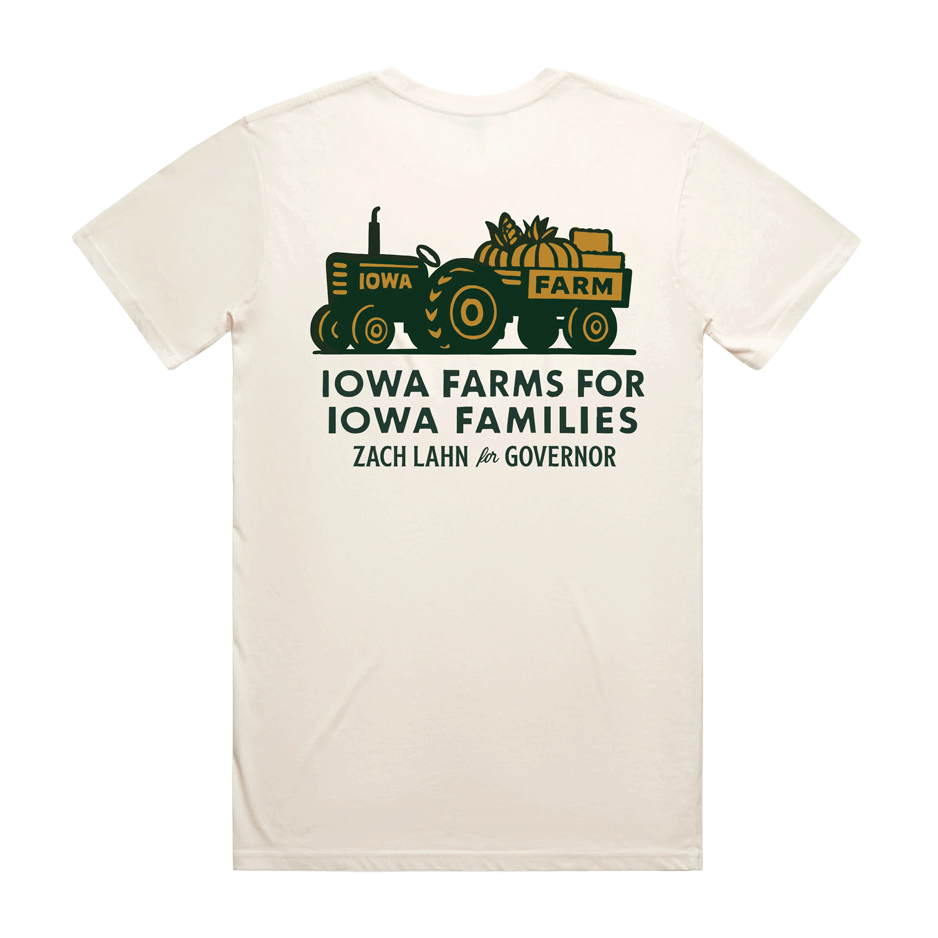 White t-shirt mockup displaying "Iowa Farms for Iowa Families" design, featuring a tractor and pumpkins