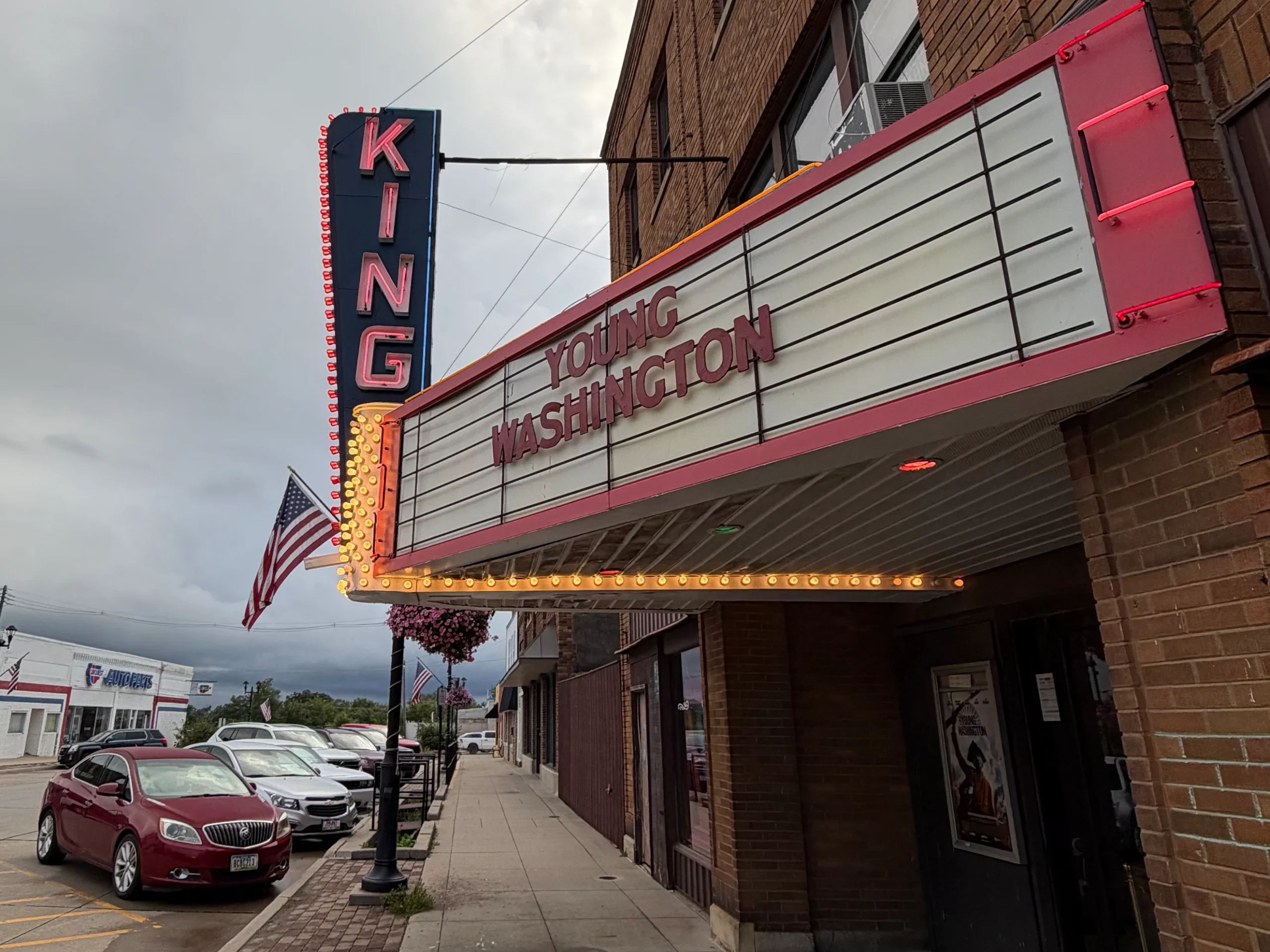 Restored King Theatre in Belle Plaine, Iowa, features a vintage marquee with illuminated lettering